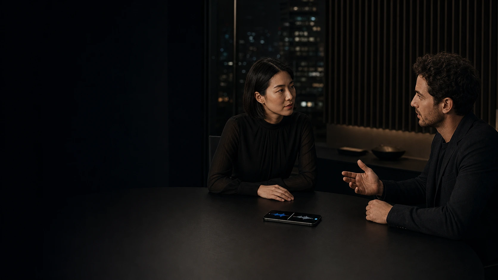 Two people using TranslateGo for a live conversation across a table